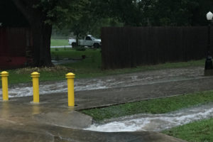 Water rushes around bollards on the Chaparral Trail.