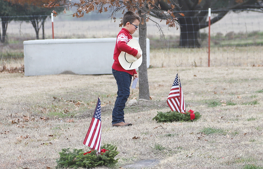 Wreaths laid in solemn remembrance